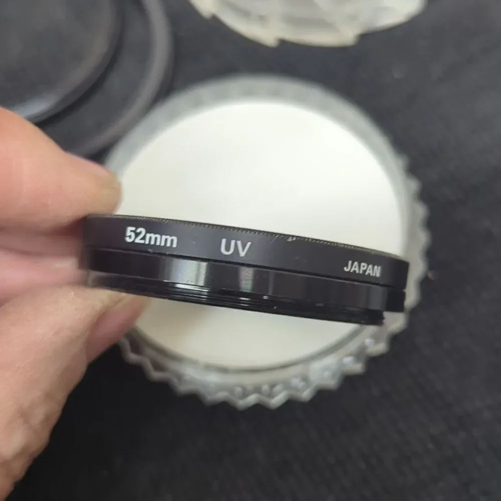 collection‎ of camera lens filters, likely used for photography
